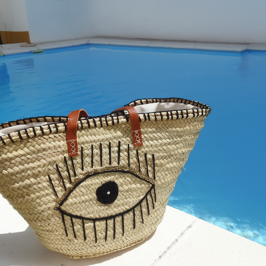 capazo natural de paja con diseño ojo para playa - Velea